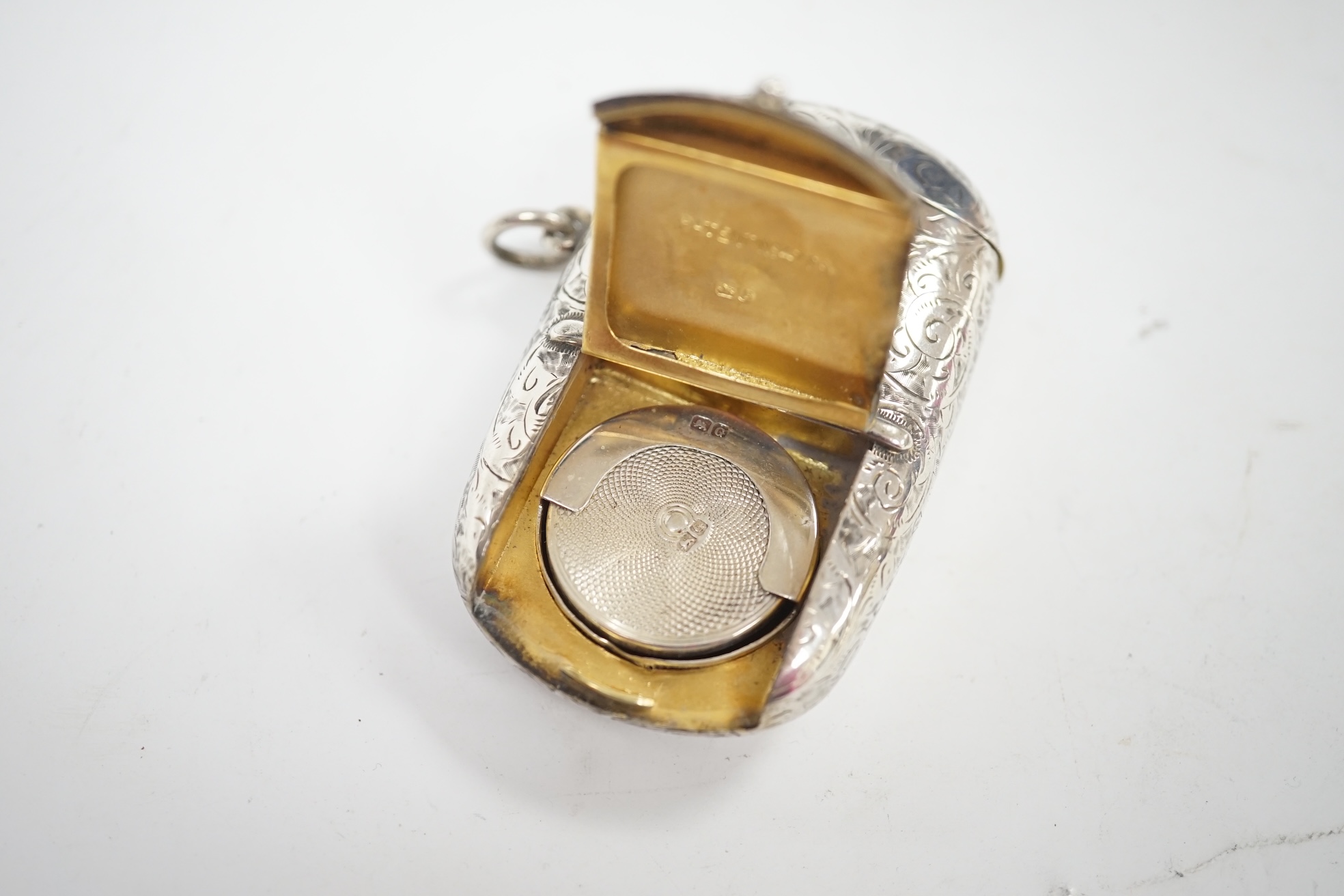 A late Victorian silver combination sovereign and vesta case, with pencil (lacking another item?, William Neale, Chester, 1890, 59mm. Condition - fair to good